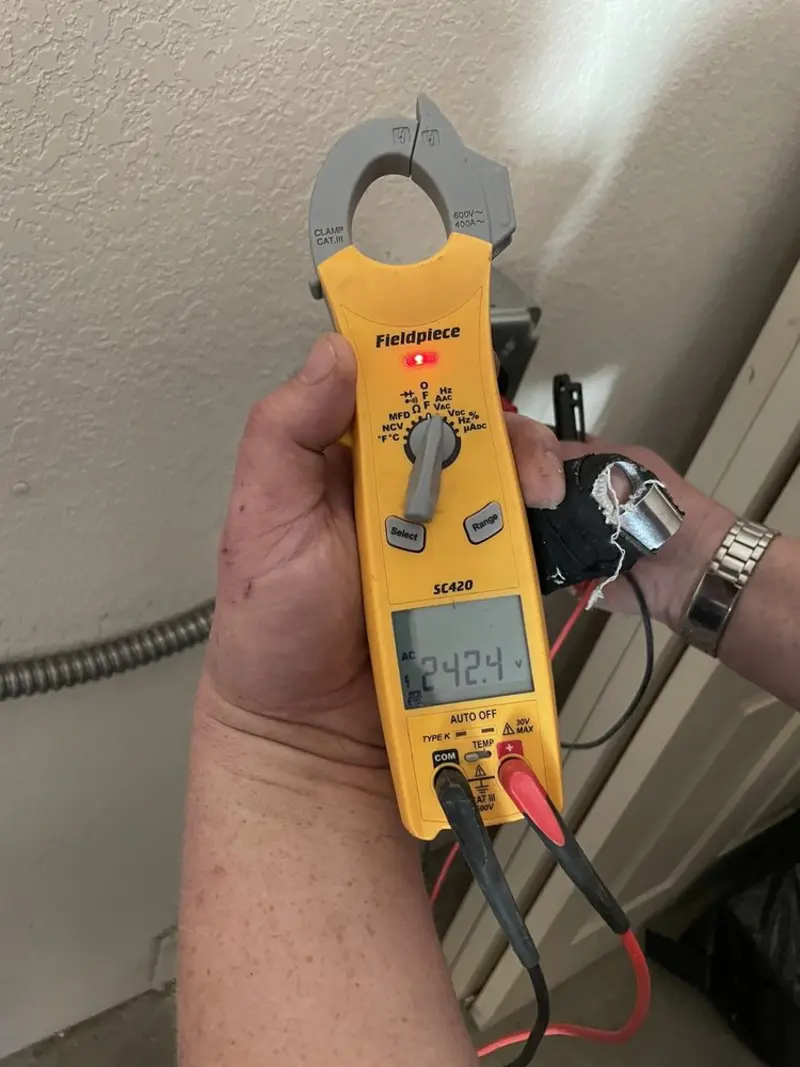 Voltage testing with clamp meter during Electrical Installation Services in Star